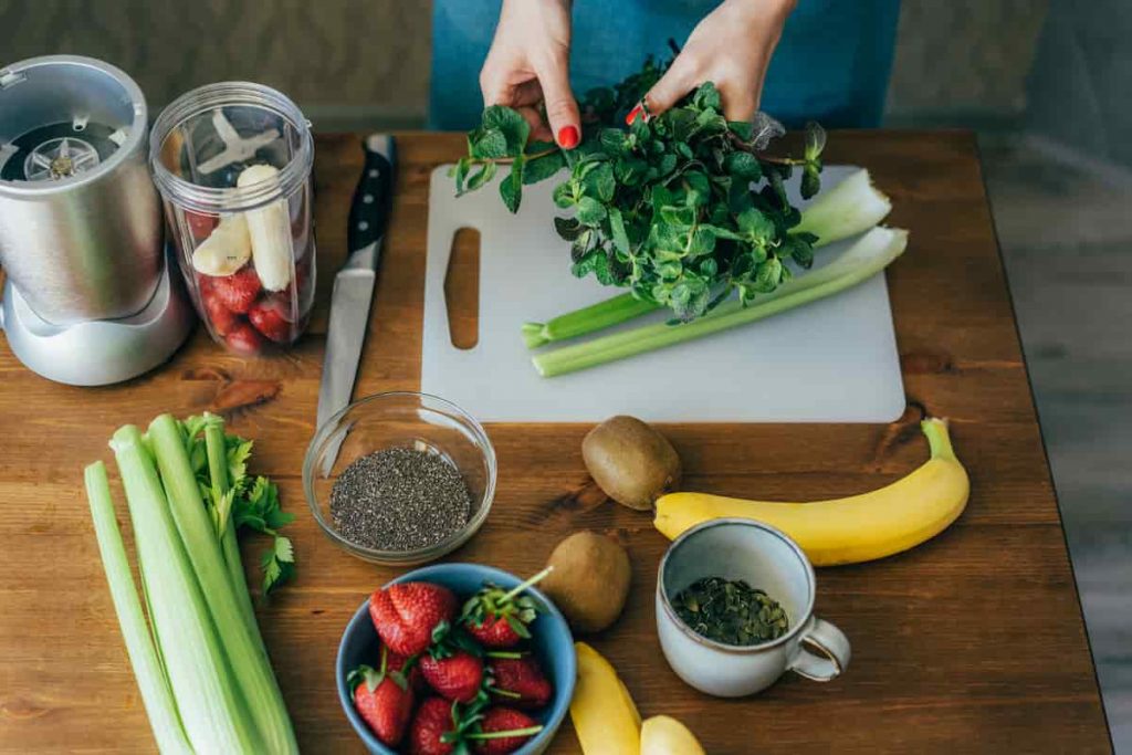 Person preparing vegetables and fruit | Does high blood pressure make you tired? | e-Surgery