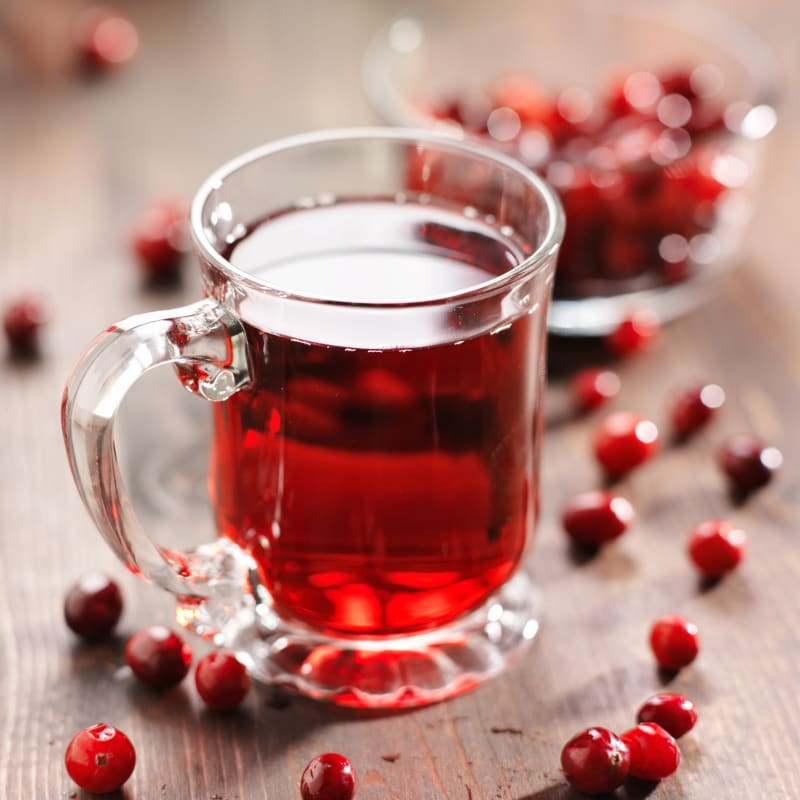 Does cranberry juice help with periods and PMS? Cranberry juice on table